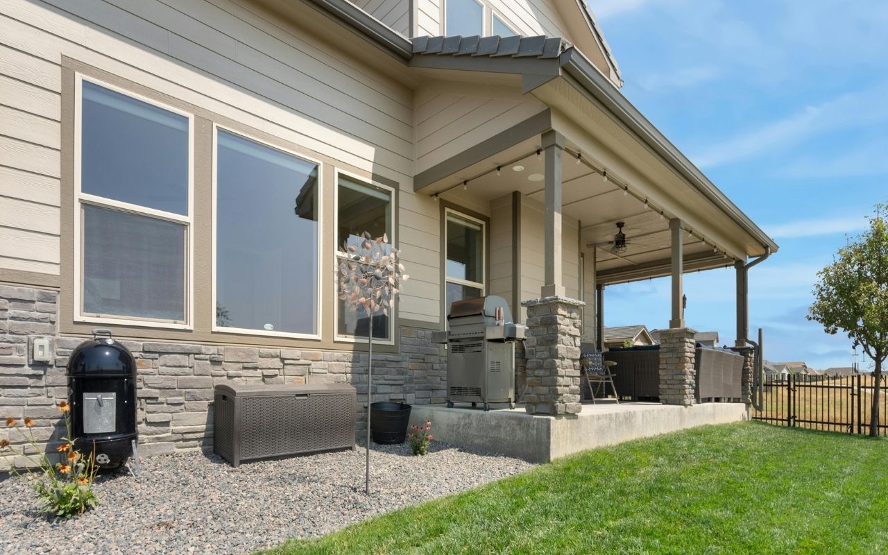 House with vinyl siding, matching white trim