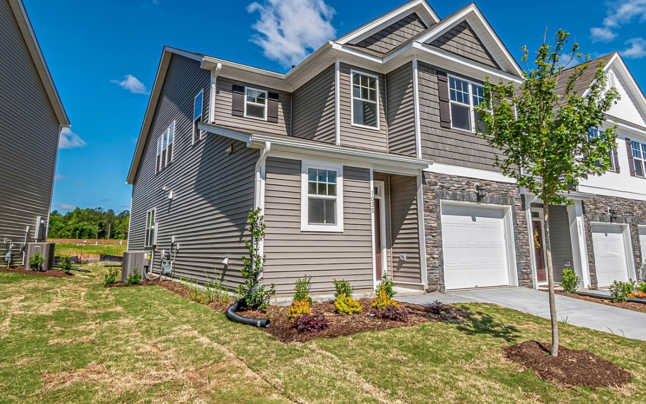 Modern home with navy and white vinyl siding combination