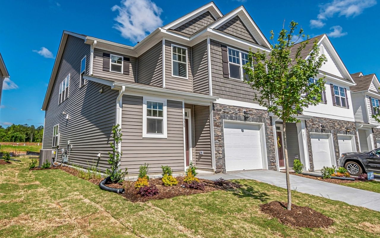 Close-up of dark blue siding paired with bright white trim