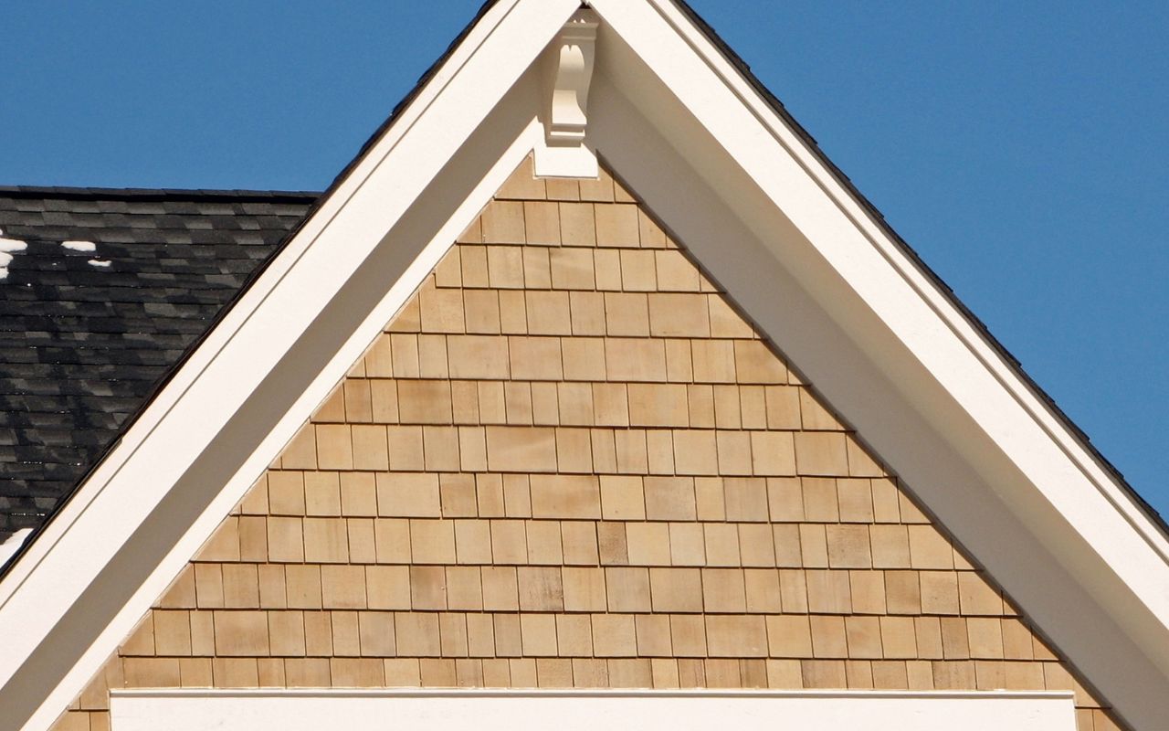 Wood-textured vinyl siding close-up on modern home