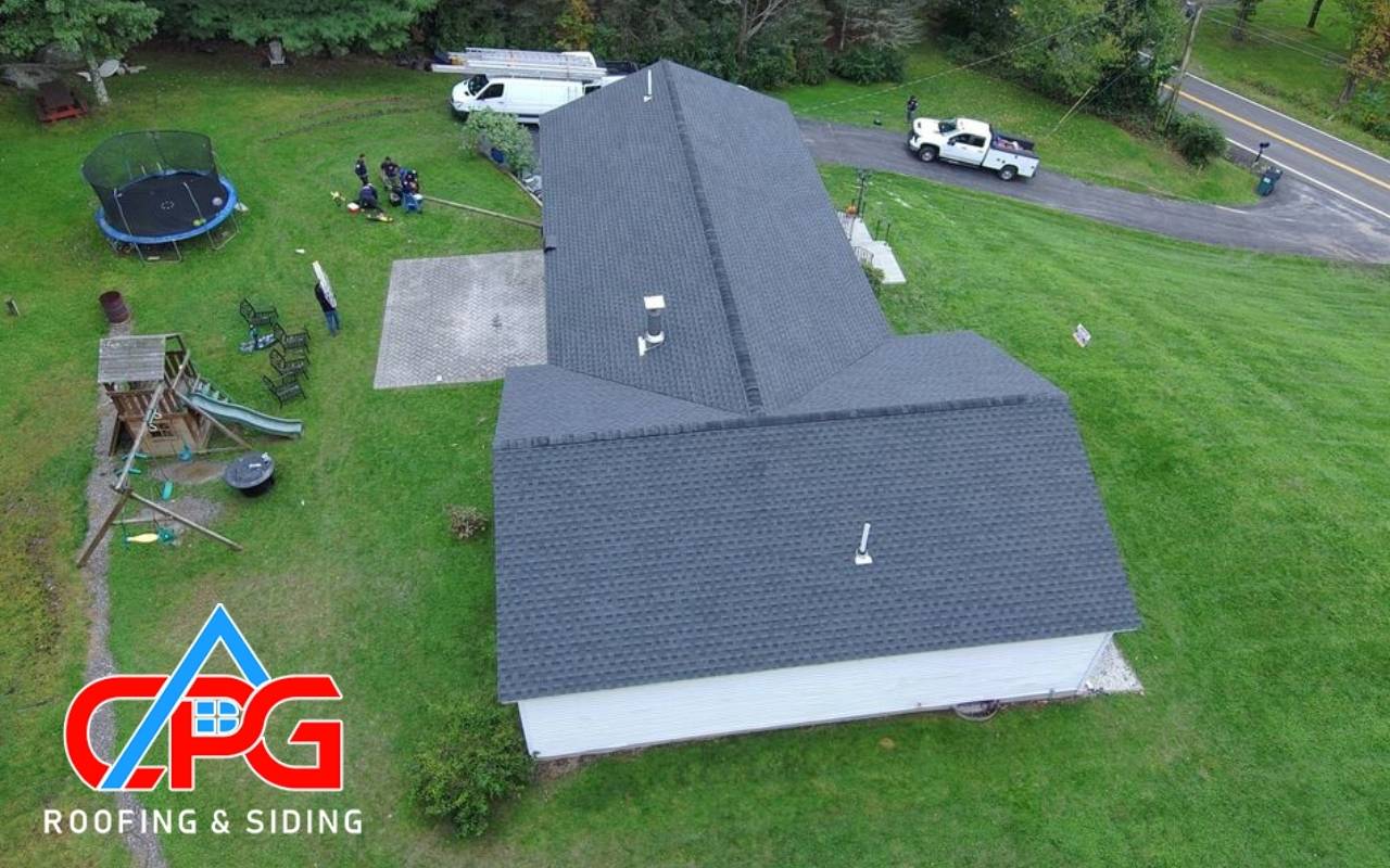Close-up of missing shingles on a roof in Orange County NY showing early warning signs.
