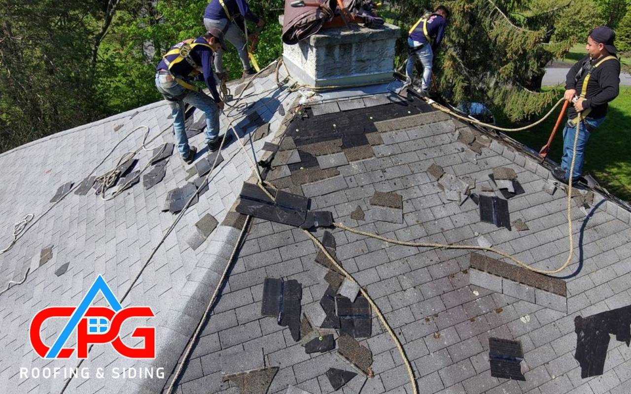 Professional roof inspector examining a roof for aging roof signs in Orange County